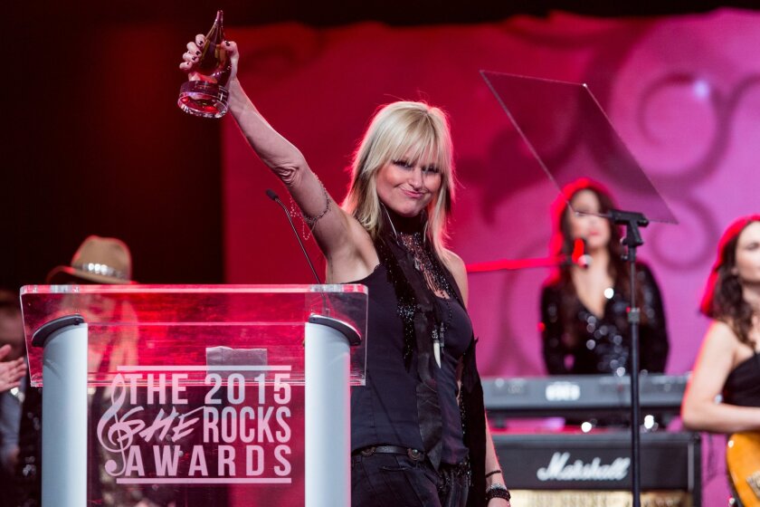 Mindi Abair receives an award during the NAMM's 2015 She Rocks Awards.