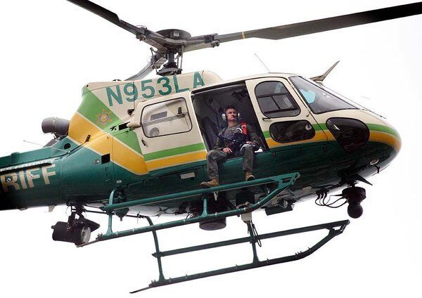 A Los Angeles County Sheriff's Department helicopter circles Santa Monica College with a sharpshooter.