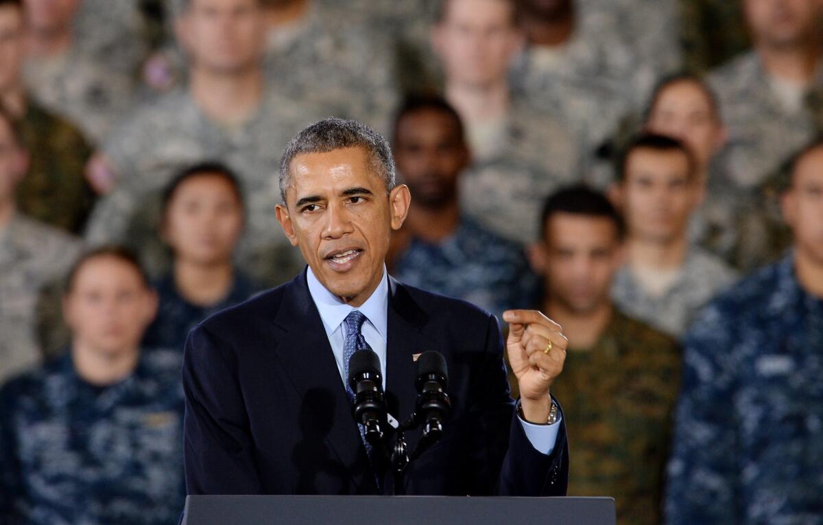 President Obama addresses troops gathered at Joint Base McGuire-Dix-Lakehurst in Wrightstown, N.J., on Monday. Obama thanked troops and their families for their service.