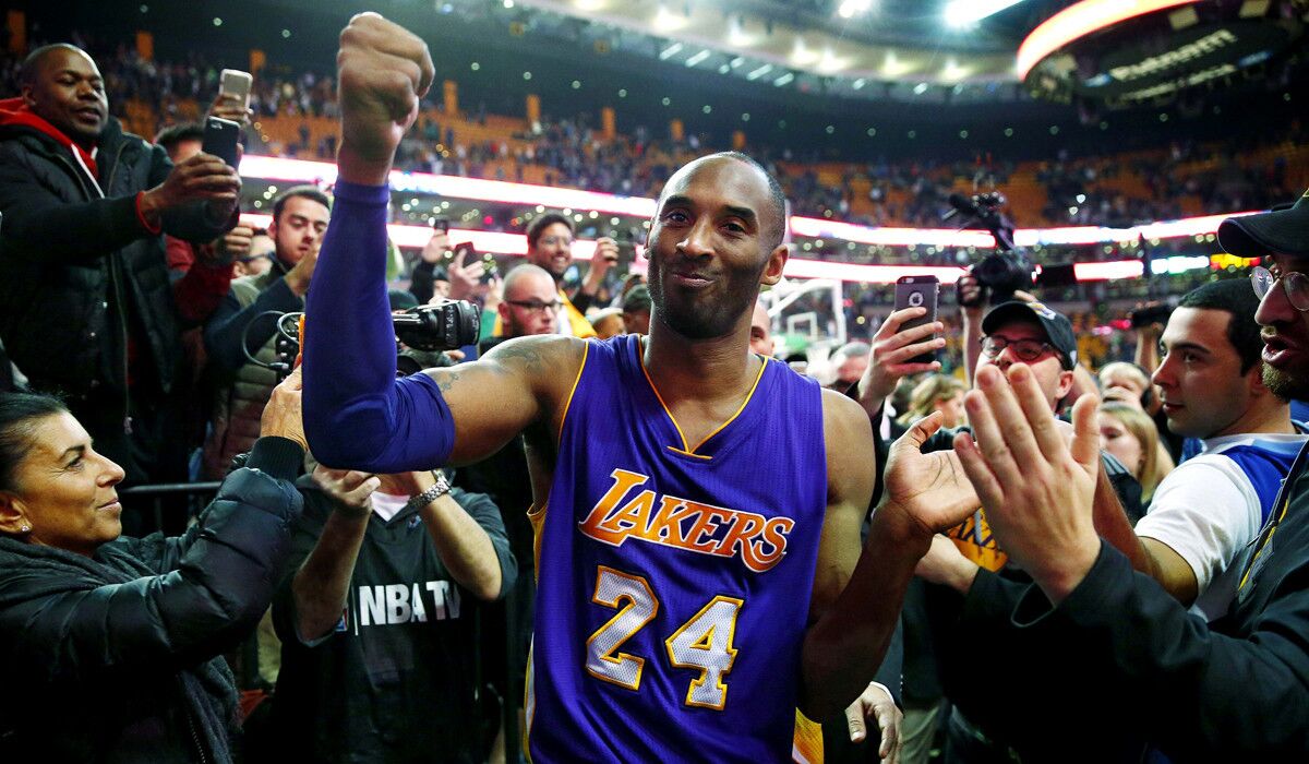 The Lakers' Kobe Bryant acknowledges the fans as he walks off the court in Boston after the Lakers' 112-104 win over the Celtics on Wednesday.