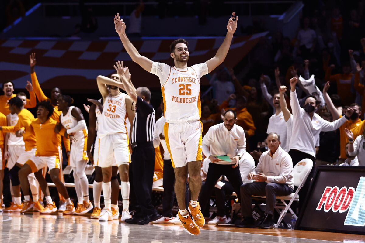 Tennessee guard Santiago Vescovi (25) reacts to hitting a go-ahead 3-point shot to give Tennessee the lead during an NCAA college basketball game against Mississippi on Wednesday, Jan. 5, 2022, in Knoxville, Tenn. Tennessee won 66-60 in overtime. (AP Photo/Wade Payne)