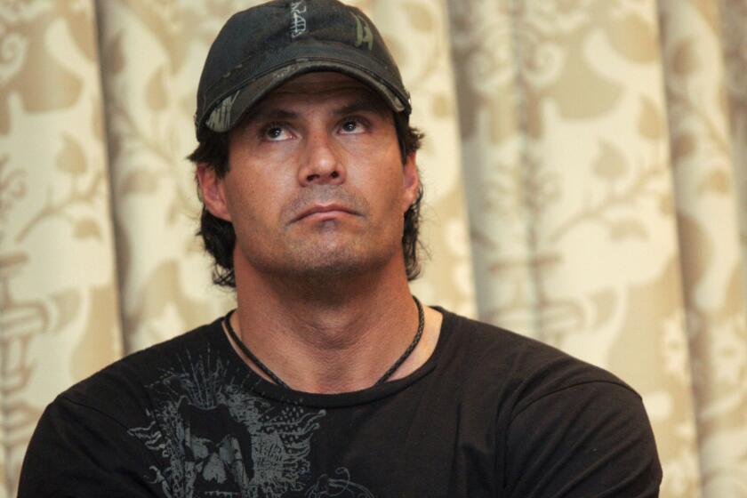 Former baseball player Jose Canseco is undergoing surgery after shooting his finger in his Las Vegas home.