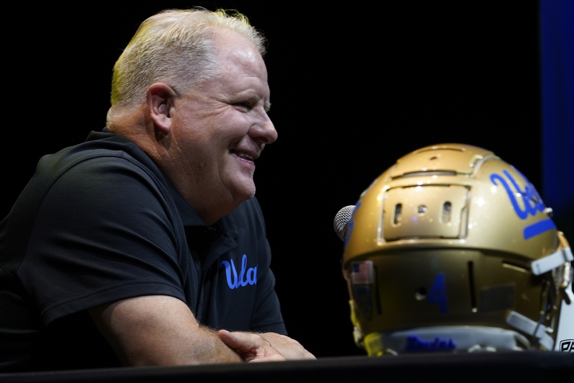 UCLA coach Chip Kelly smiles.