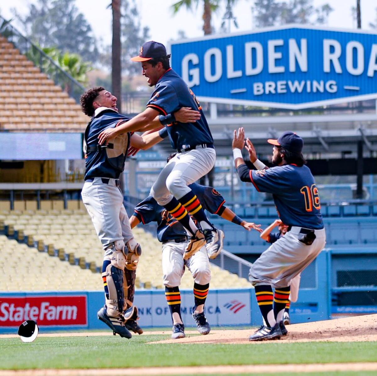 Chatsworth pitcher Jose Ruedas celebrates in the arms of catcher Isaiah Granados.