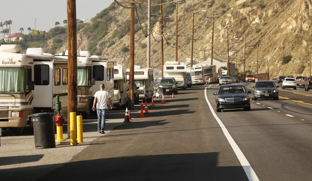 RVs and other vehicles in which people are living fill a stretch of the shoulder of  Pacific Coast Highway at Las Tunas Beach in Malibu in January. 