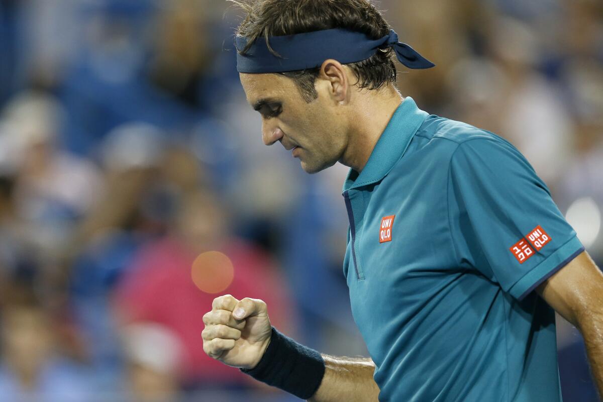 Roger Federer pumps his fist after match point in the second set against Juan Ignacio Londero at the Western & Southern Open tennis tournament in Mason, Ohio, Tuesday, Aug. 13, 2019. (Sam Greene/The Cincinnati Enquirer via AP)