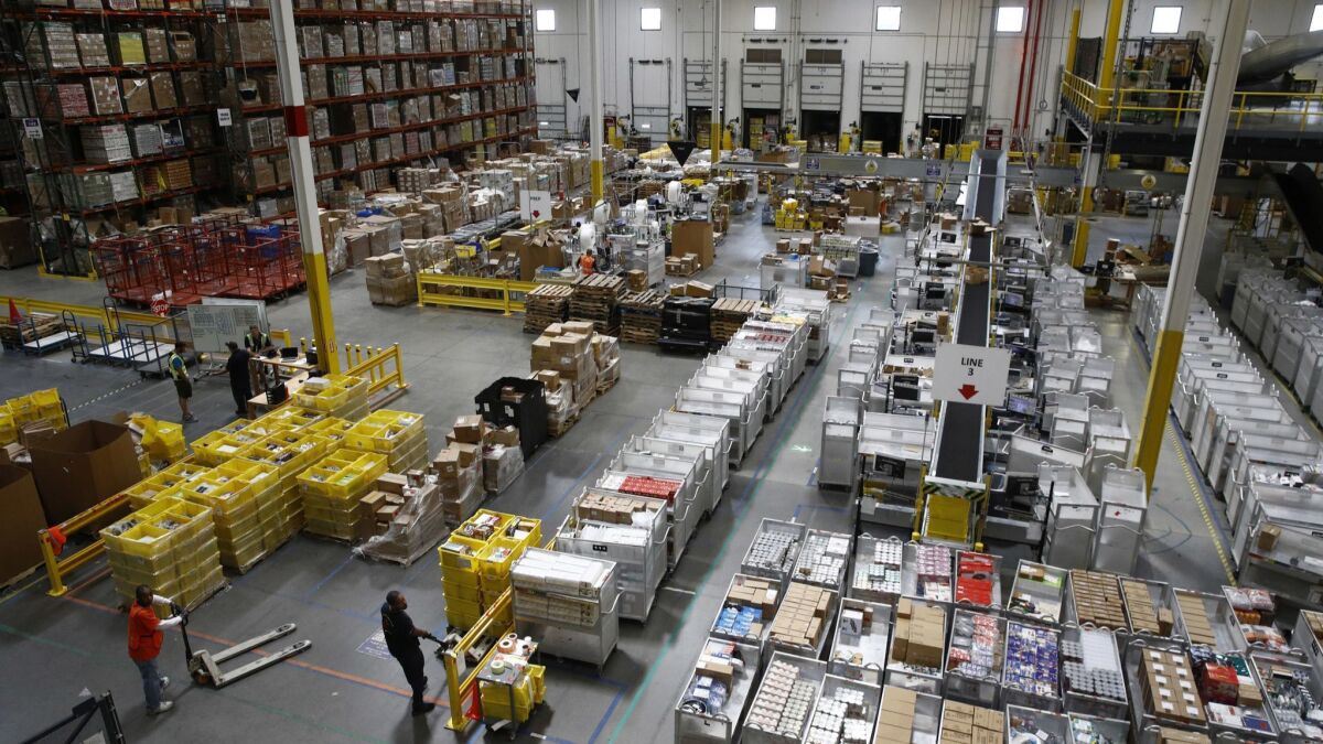 Workers prepare products at an Amazon fulfillment center in Baltimore last year.