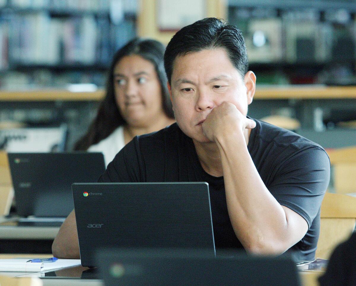 Parent James Yun explores Google Clasroom.