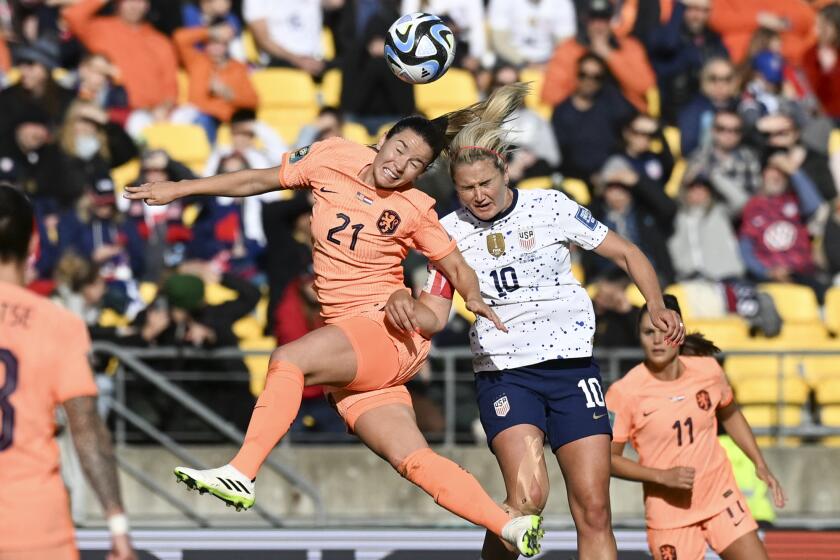 Netherlands' Damaris Egurrola, left, and United States' Lindsey Horan compete to head the ball during the Women's World Cup Group E soccer match between the United States and the Netherlands in Wellington, New Zealand, Thursday, July 27, 2023. (AP Photo/Andrew Cornaga)
