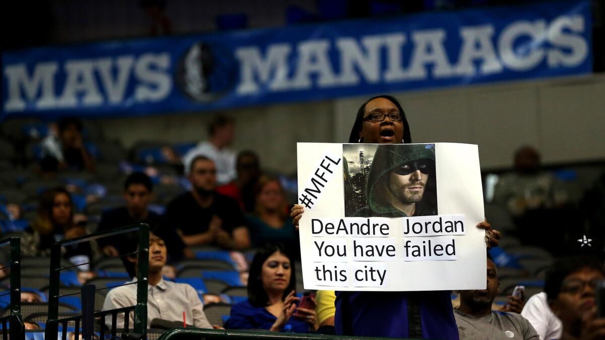 A Mavericks fan shows her discontent with Clippers center DeAndre Jordan before a Nov. 11 game in Dallas.