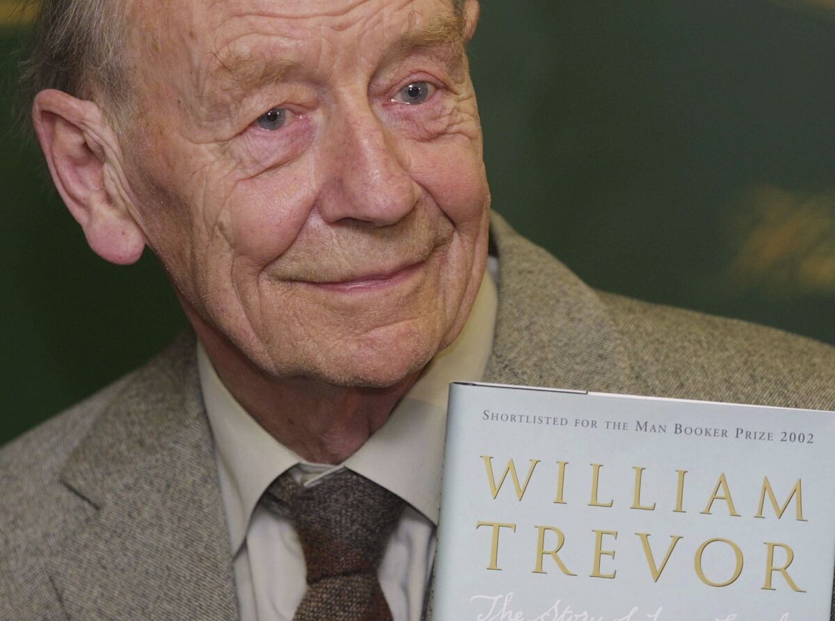 William Trevor holds a copy of his book "The Story of Lucy Gault" in 2002.