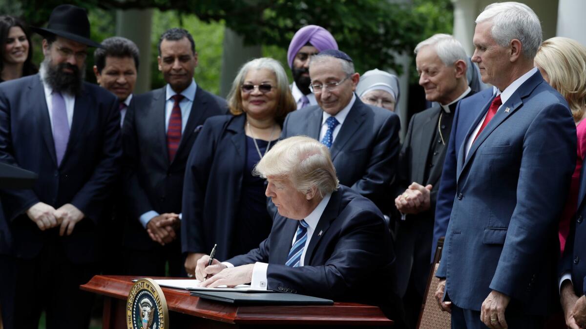 President Trump signs an executive order asking the IRS to use "maximum enforcement discretion" regarding religious groups that get involved in partisan politics.