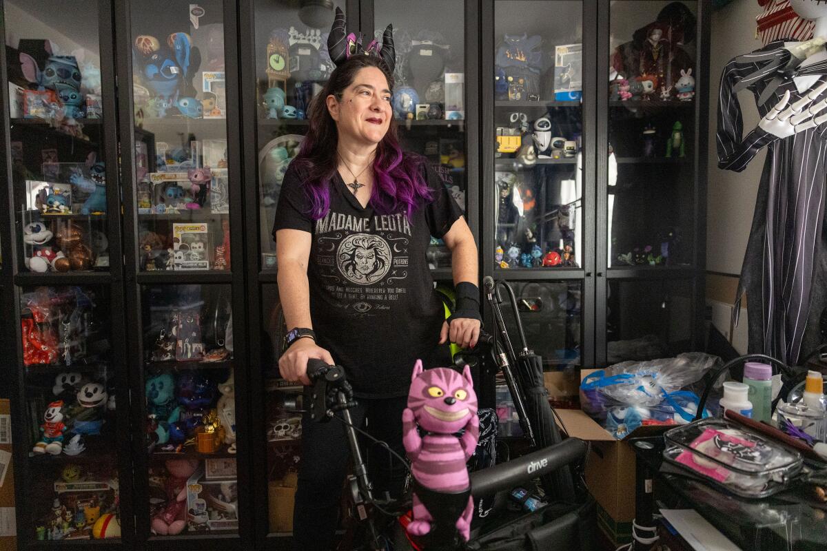 A Disney fan stands in her home filed with curios and talks about her Disability Access Service pass experience.