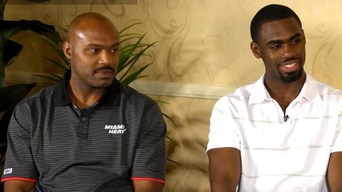 Former NBA star Tim Hardaway Sr., left, with his son.