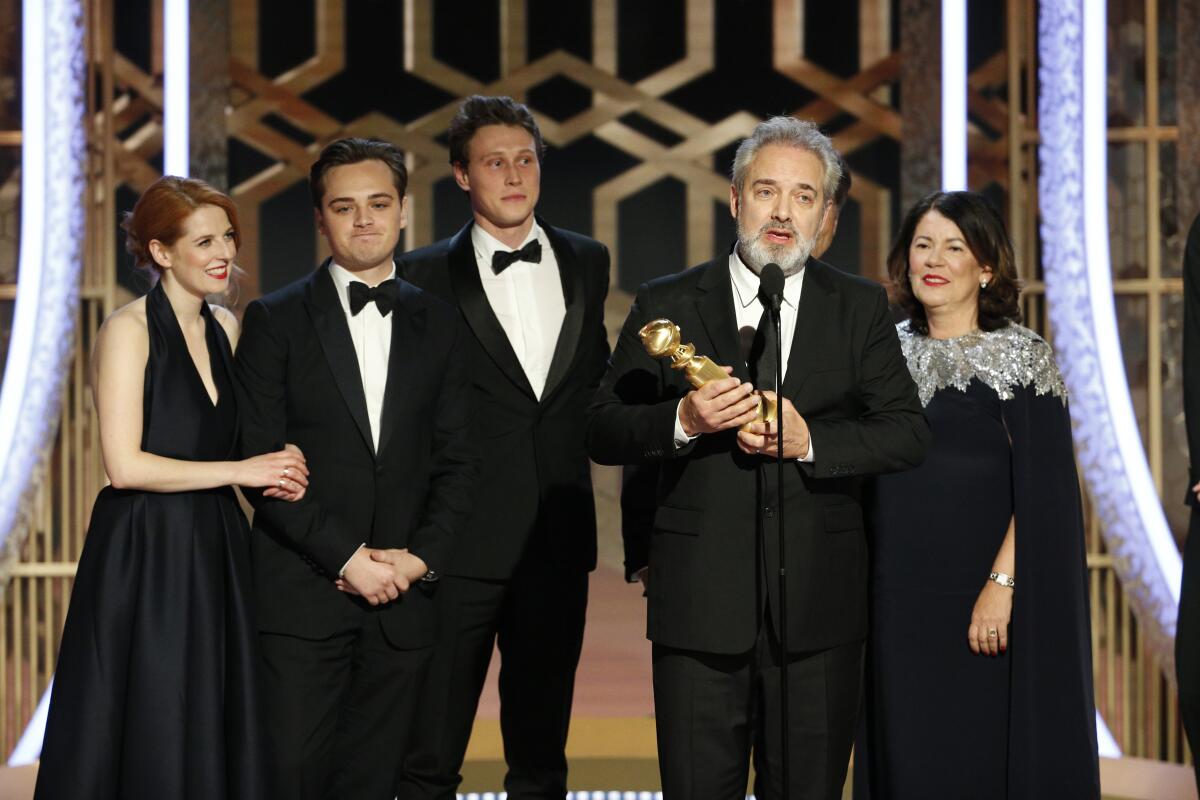 Filmmaker Sam Mendes accepts the award for best motion picture drama for "1917" at the 77th Golden Globe Awards.
