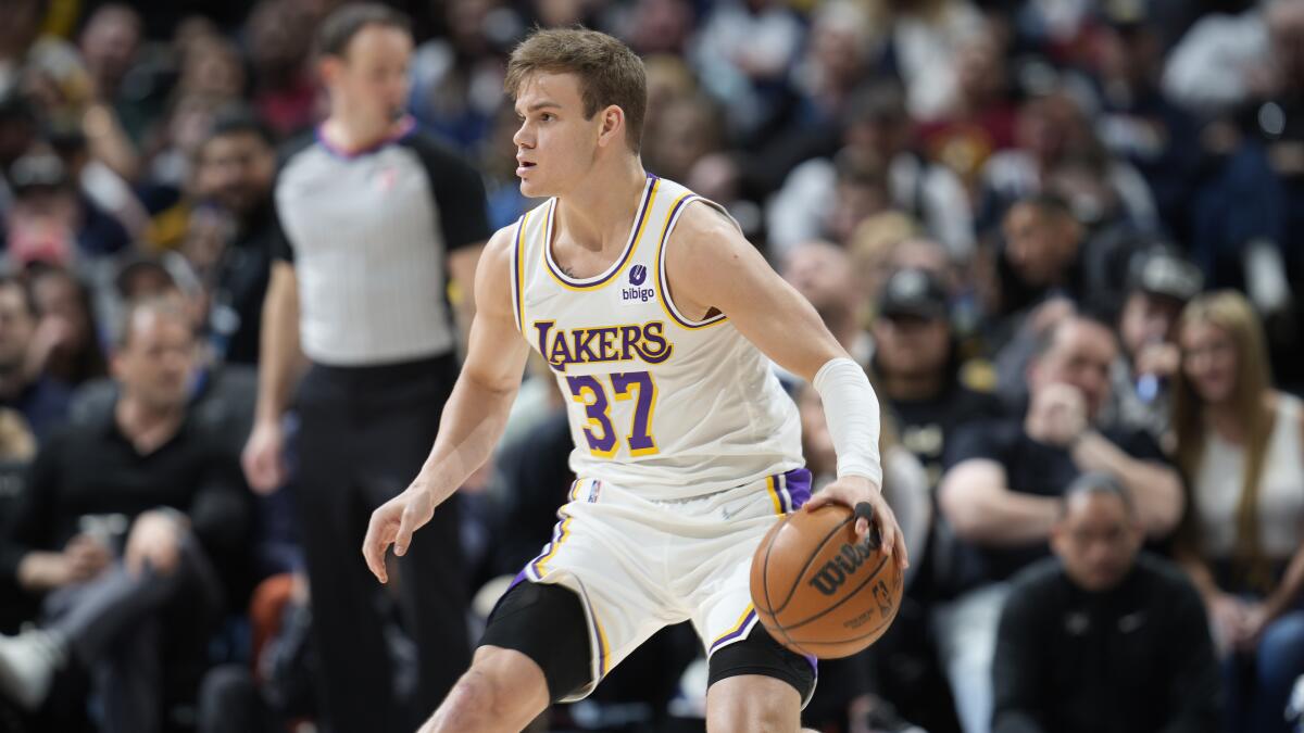 Lakers guard Mac McClung dribbles the ball as he sets up the offense.