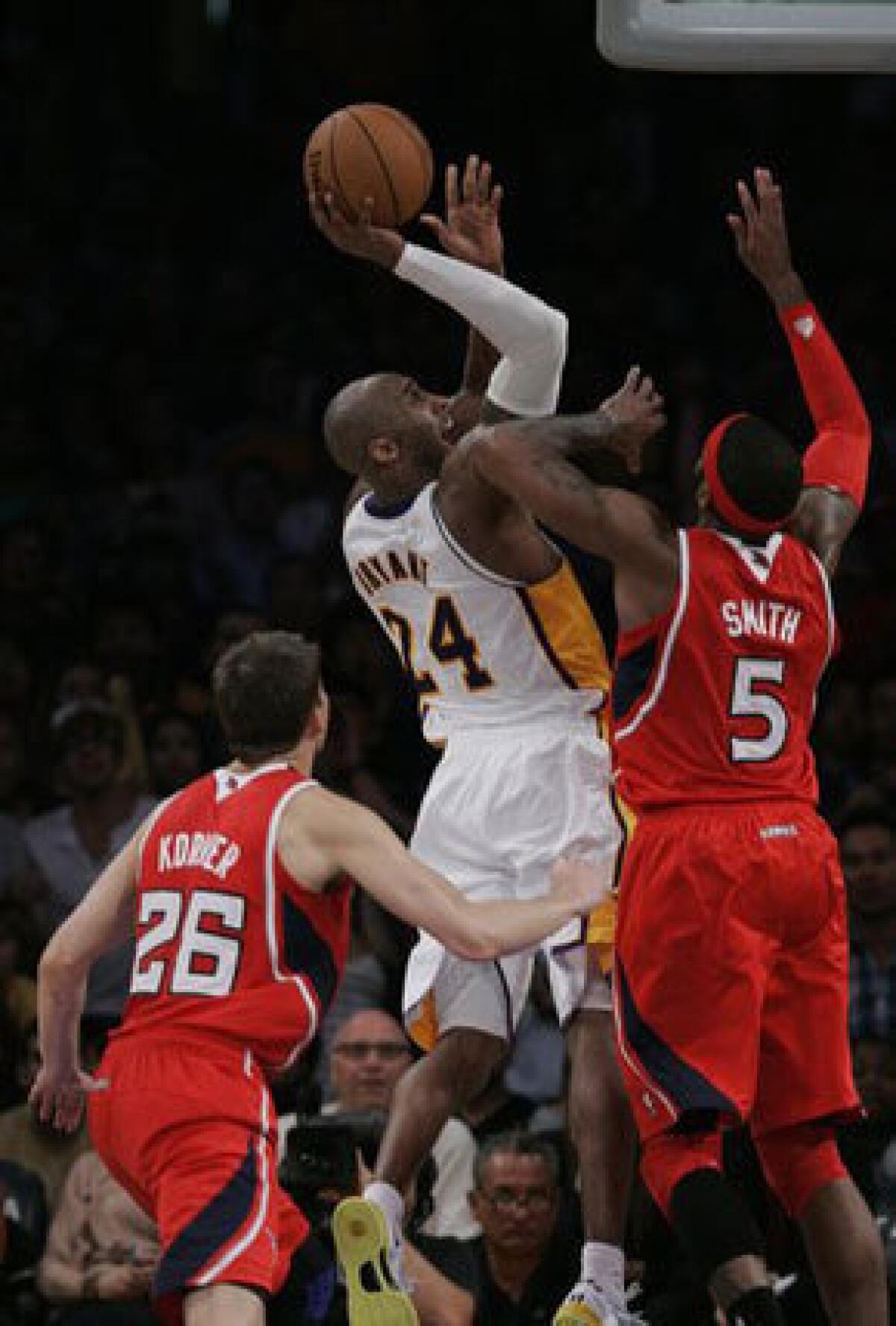 Lakers guard Kobe Bryant shoots over Atlanta forward Josh Smith.