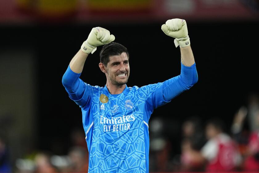 FILE - Real Madrid's goalkeeper Thibaut Courtois celebrates at the end of the Copa del Rey soccer final after they defeated Osasuna 2-1 at La Cartuja stadium in Seville, Spain, on May 6, 2023. Courtois is ready to play his first game of the season against Cadiz on Saturday after recovering from a long injury layoff, coach Carlo Ancelotti said Friday May 3, 2024. (AP Photo/Jose Breton, File)