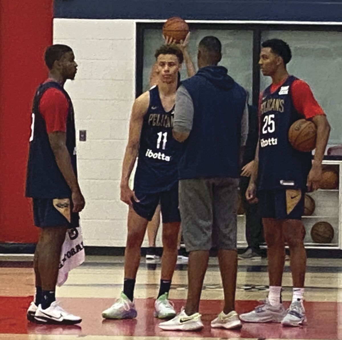 New Orleans Pelicans assistant coach Jarron Collins talks with the team's two Rookies; E.J. Liddell and Dyson Daniels, while second year Guard Trey Murphy III listens to instruction at the Ochsner Sports Performance Center in Metairie, La., Saturday, July 2, 2022. (Hunter Dawkins/The Gazebo Gazette via AP)
