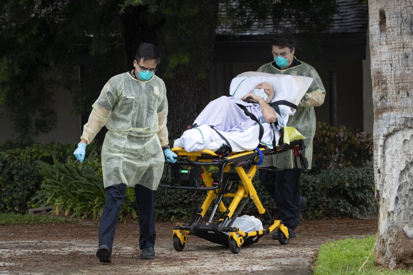 Bernie Erwig, 84, is removed from Magnolia Rehabilitation and Nursing Center in Riverside.