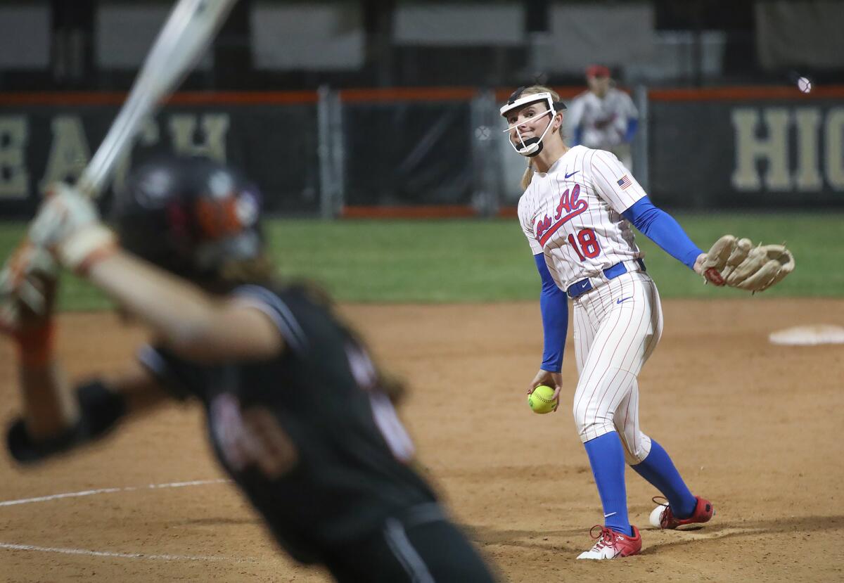 Los Alamitos pitcher Cari Ferguson (18) delivers a pitch during Sunset League girls' softball finale.