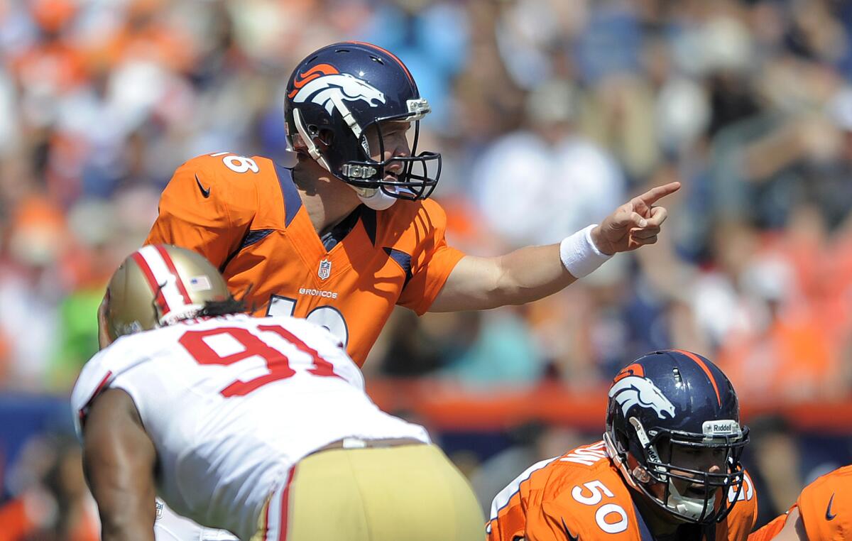 Denver Broncos quarterback Peyton Manning calls a play during the first quarter of an NFL preseason game Sunday.