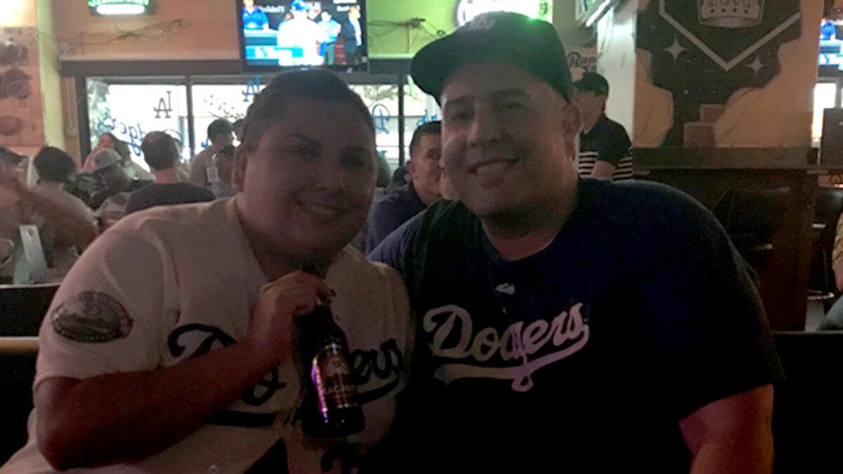 Kevin and Karla Torres join other Dodgers fans at The Down and Out bar for Game 1 of the World Series.