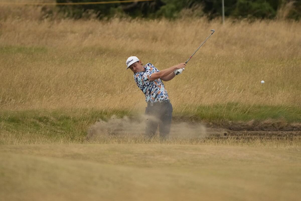 Cameron Smith, of Australia, plays out of a bunker on the 13th hole during the third round of the British Open golf championship on the Old Course at St. Andrews, Scotland, Saturday July 16, 2022. (AP Photo/Gerald Herbert)