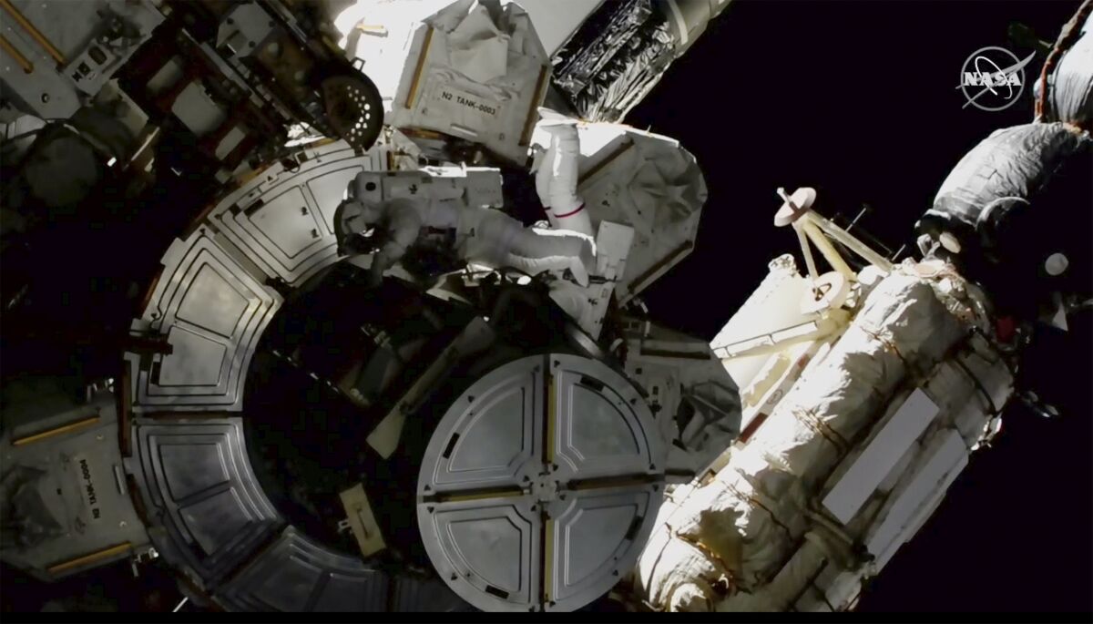NASA astronauts Victor Glover and Mike Hopkins on a spacewalk outside the International Space Station 