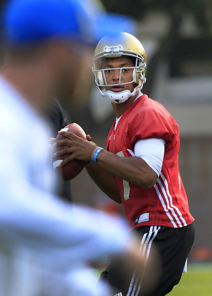 UCLA starting quarterback Brett Hundley practices on the field at UCLA.