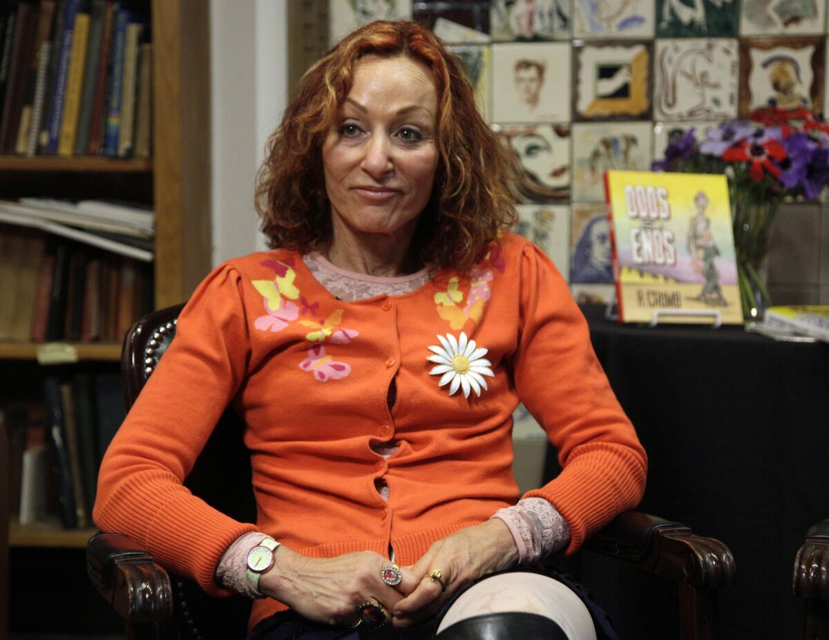 FILE - Comics illustrator Aline Kominsky-Crumb appears during an interview at the Society of Illustrators in New York on March 24, 2011. Kominsky-Crumb has died at the age of 74. A close collaborator of her cartoonist husband, Robert Crumb, she died of cancer Tuesday at their longtime home in France. (AP Photo/Richard Drew, File)