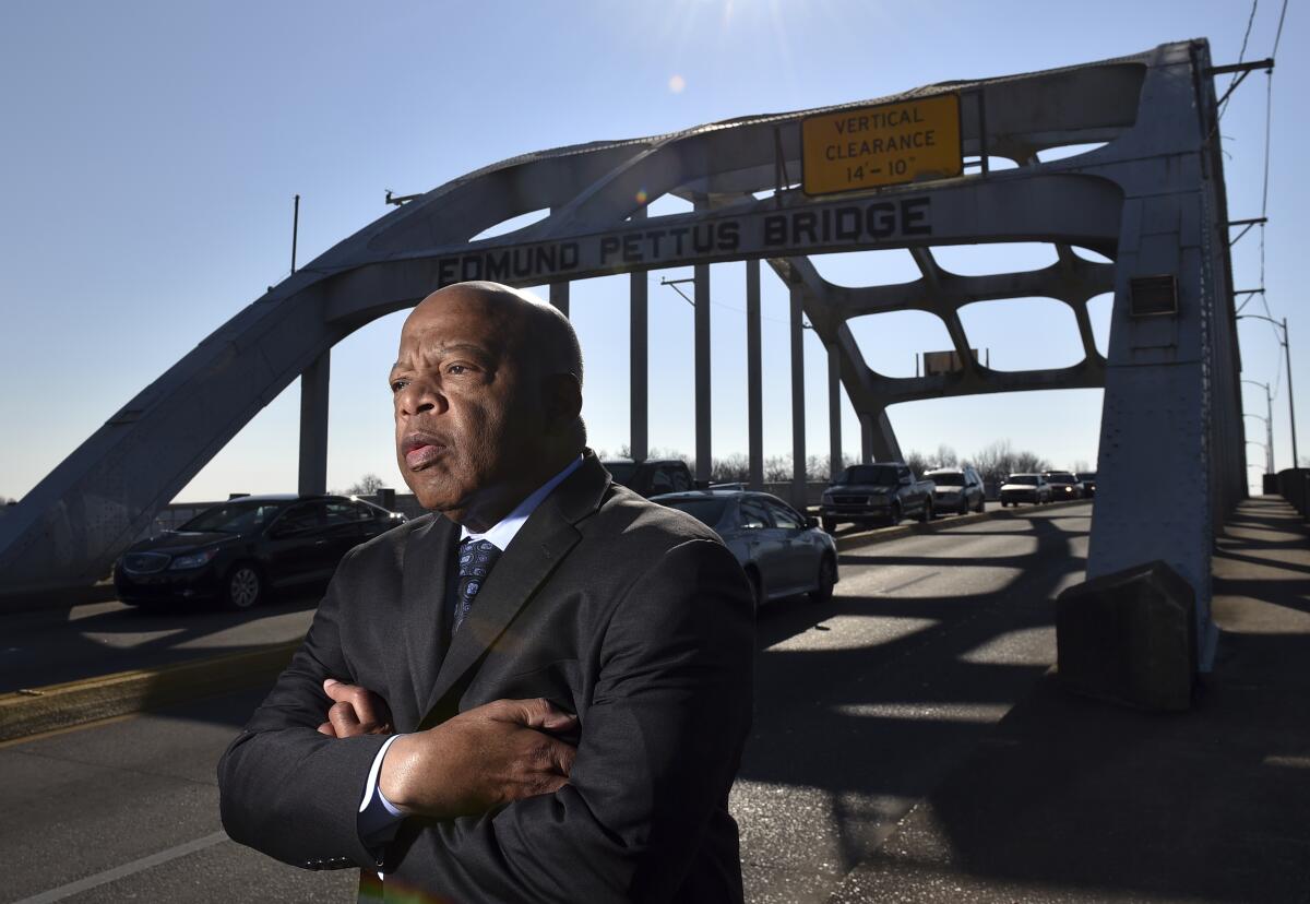 Congressman John Lewis stands on the Edmund Pettus Bridge in Selma in 2015