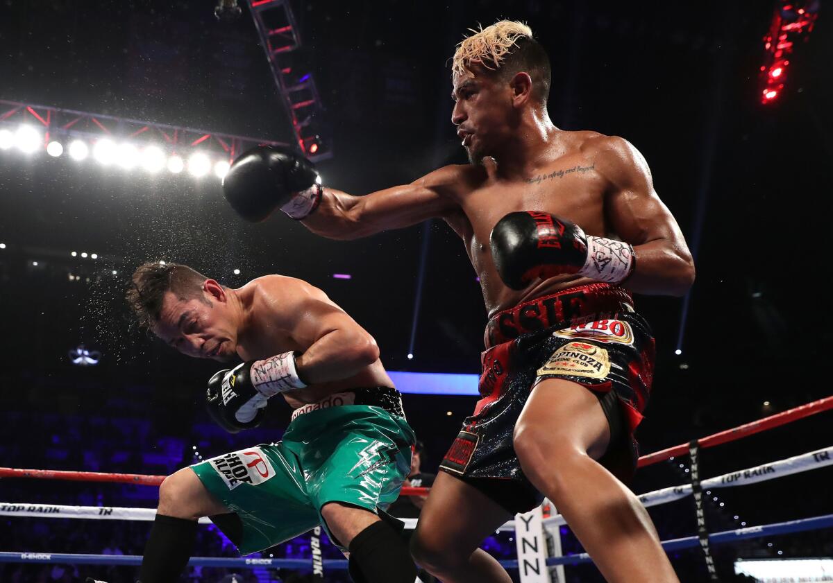 LAS VEGAS, NV - NOVEMBER 05: (R-L) Jessie Magdaleno lands a right to the head of Nonito Donaire of the Philippines during their WBO junior featherweight championship fight at the Thomas & Mack Center on November 5, 2016 in Las Vegas, Nevada. (Photo by Christian Petersen/Getty Images) ** OUTS - ELSENT, FPG, CM - OUTS * NM, PH, VA if sourced by CT, LA or MoD **