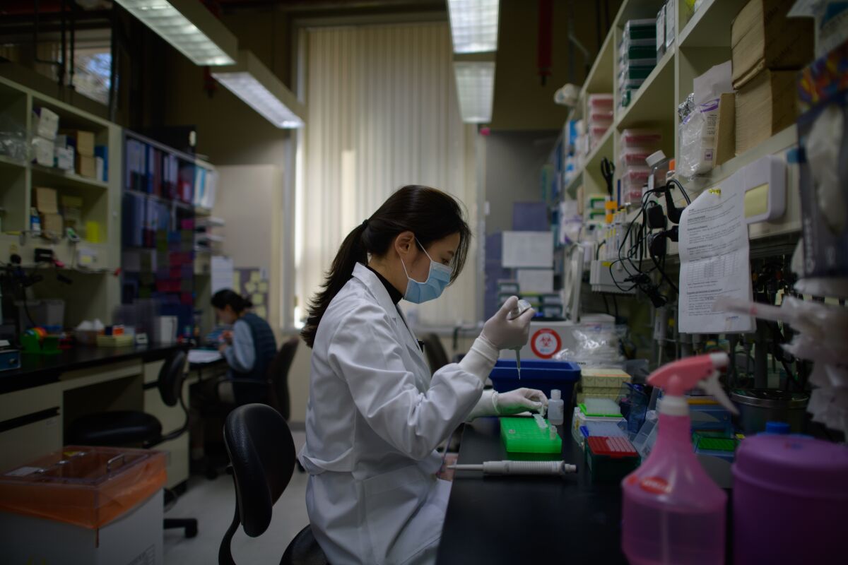 A lab technician works on an antibody test on the Middle Eastern Respiratory Syndrome coronavirus in Seoul. The country's experience with MERS informed the rapid scaling-up of proactive testing for the new coronavirus.