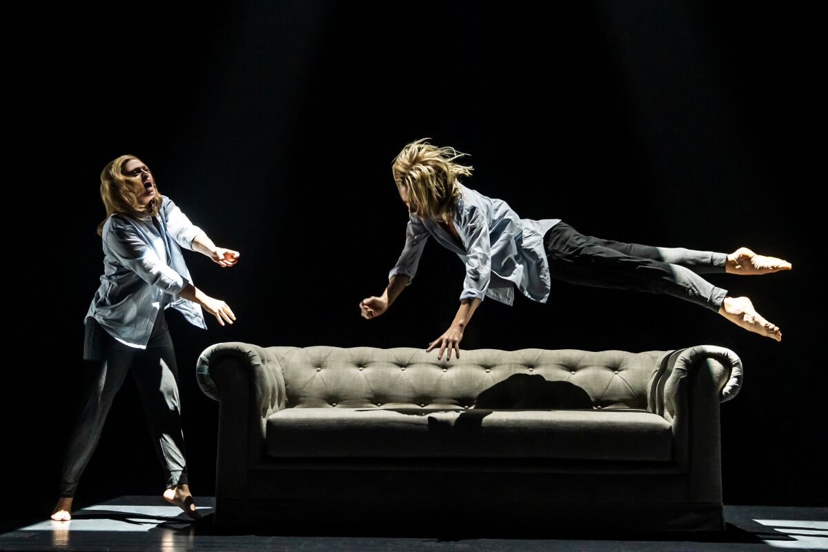 Heather Lang, right, dives onto a couch onstage with Elizabeth Stanley in "Jagged Little Pill." 