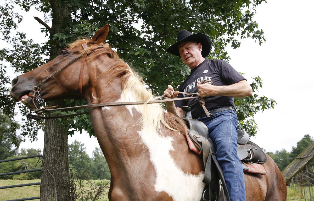 Alabama U.S. Senate candidate Roy Moore rides to the polls on Tuesday.