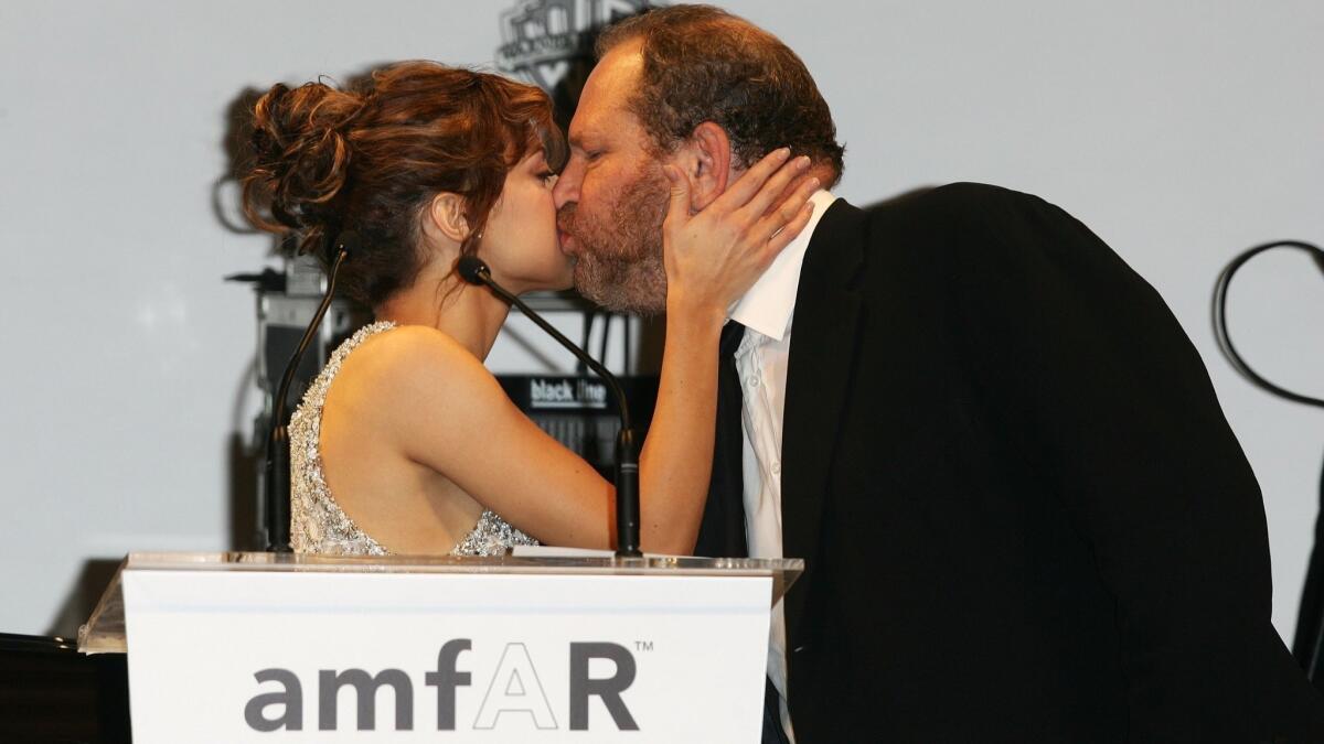 Actress Brittany Murphy and producer Harvey Weinstein at the amfAR gala in Cannes in 2005.
