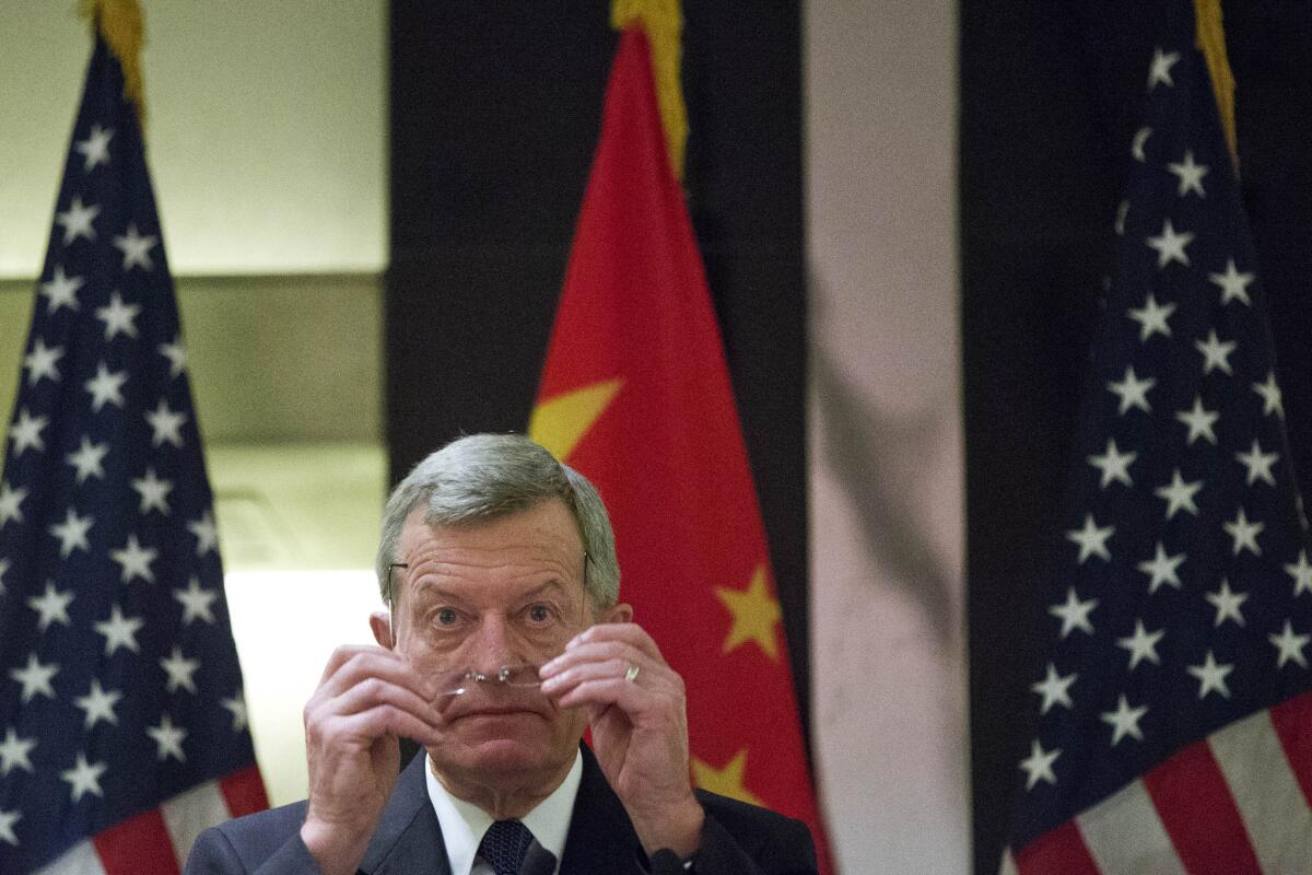 U.S. Ambassador to China Max Baucus speaks to members of the country's American business community at a hotel in Beijing.