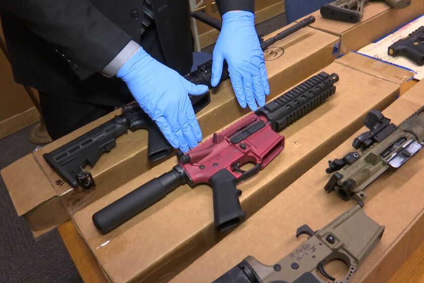 FILE - In this Nov. 27, 2019 file photo, "ghost guns" are displayed at the headquarters of the San Francisco Police Department in San Francisco. The district attorney of San Francisco announced a lawsuit Wednesday, Aug. 18, 2021, against three California companies that make and distribute "ghost guns," the untraceable, build-it-yourself weaponry that accounted for nearly half of the city's firearms recovered in gun killings last year. (AP Photo/Haven Daley, File)