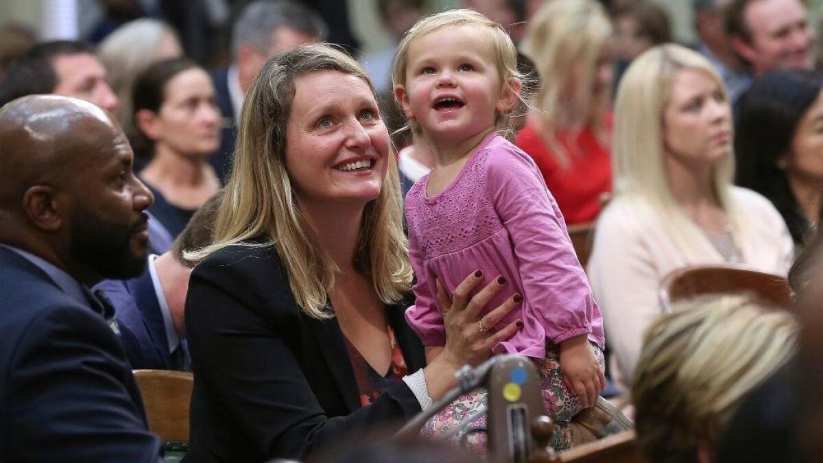 Assemblywoman Buffy Wicks, a Democrat, and her daughter, Josephine, 2, look at the Assembly Gallery during the Legislative session Dec. 3, 2018, in Sacramento.