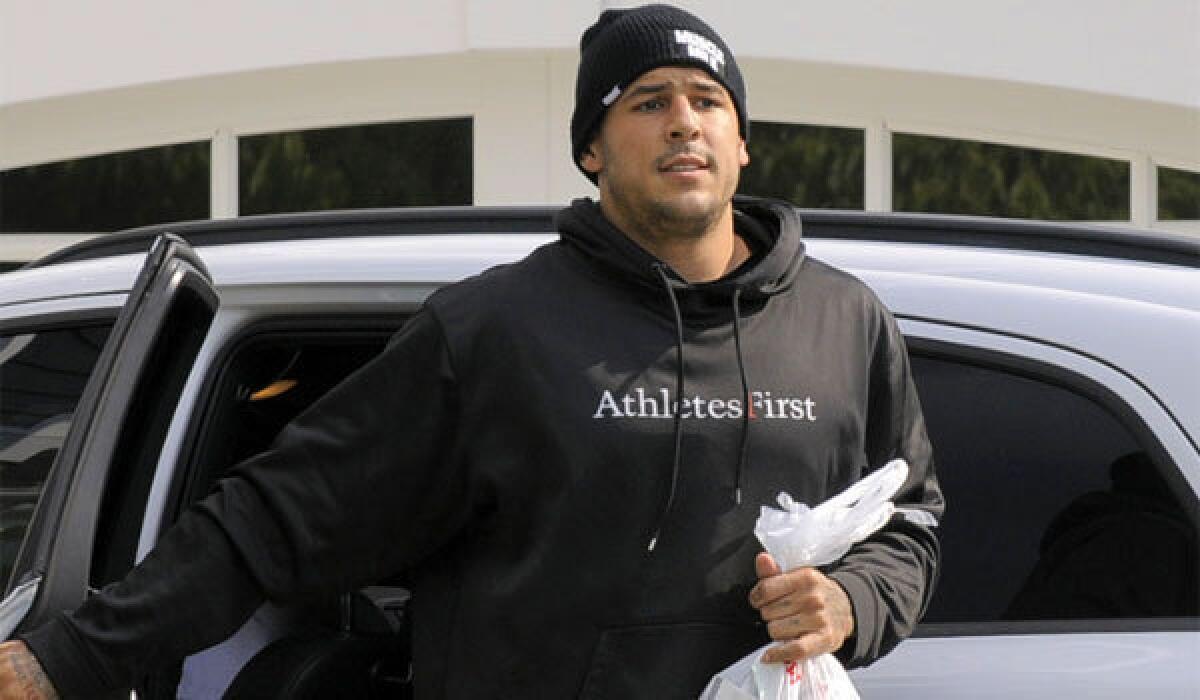 New England tight end Aaron Hernandez returns to his home in North Attleboro, Mass., on Friday.