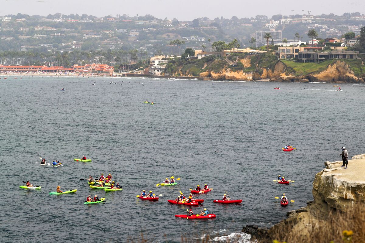 After launching at La Jolla Shores, kayakers explore the cliffs and caves along the coast near Goldfish Point in La Jolla.