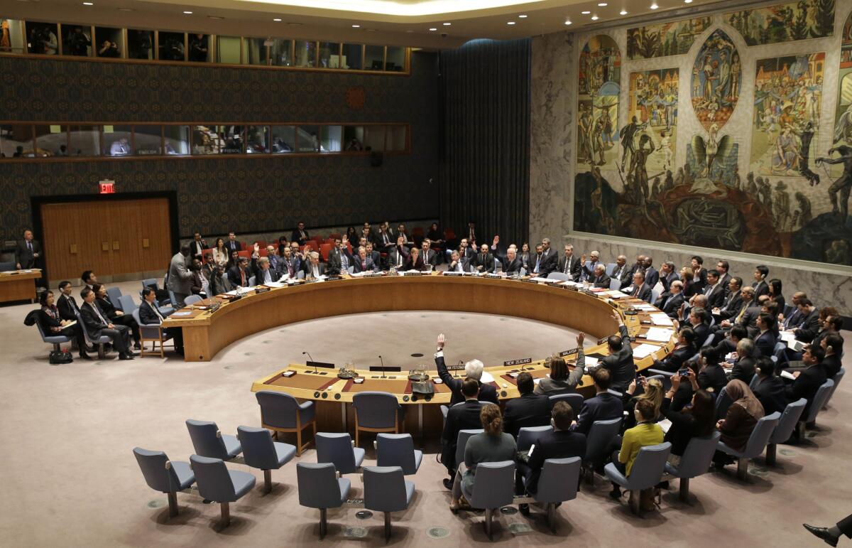 The United Nations Security Council votes on a resolution during a meeting at U.N. headquarters, Wednesday, March 2, 2016.
