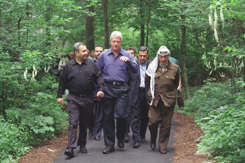 Israeli Prime Minister Ehud Barak, U.S. President Bill Clinton and Yasser Arafat, president of the Palestinian Authority, during a July 2000 summit at the presidential retreat Camp David in Maryland, from the documentary "The Human Factor."