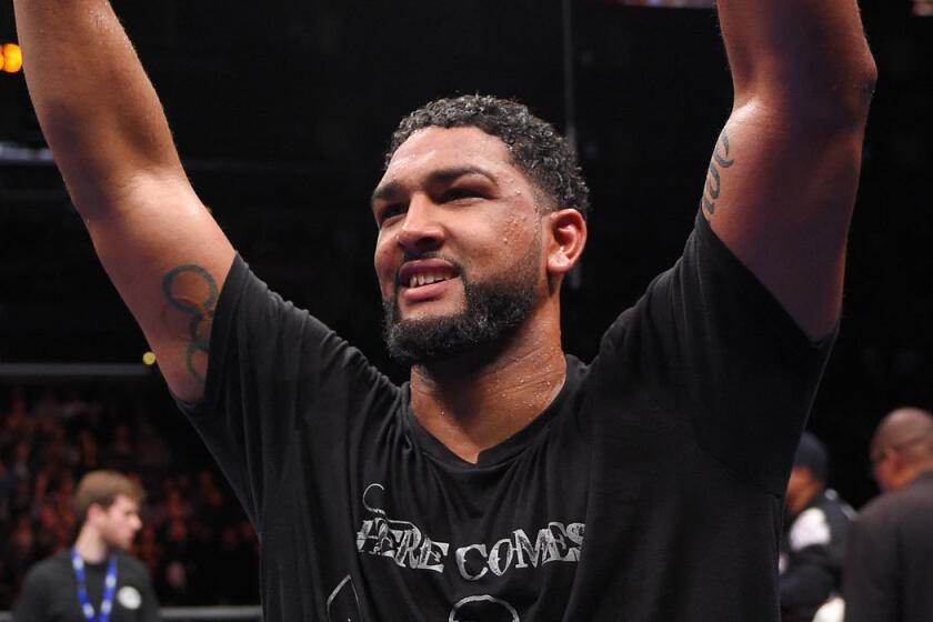 Dominic Breazeale of Upland celebrates after defeating Amir Mansour in a heavyweight match at Staples Center on Jan. 23.