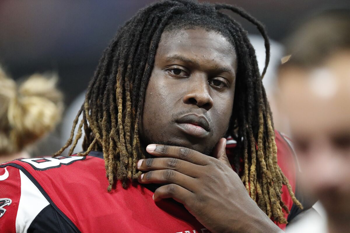 FILE - In this Aug. 17, 2018, file photo, Atlanta Falcons defensive end Takk McKinley (98) sits on the bench during the second half of an NFL preseason football game against the Kansas City Chiefs, in Atlanta. Defensive end Takk McKinley may have jeopardized his future with the Falcons by using social media to complain about not being traded. (AP Photo/John Bazemore, File)
