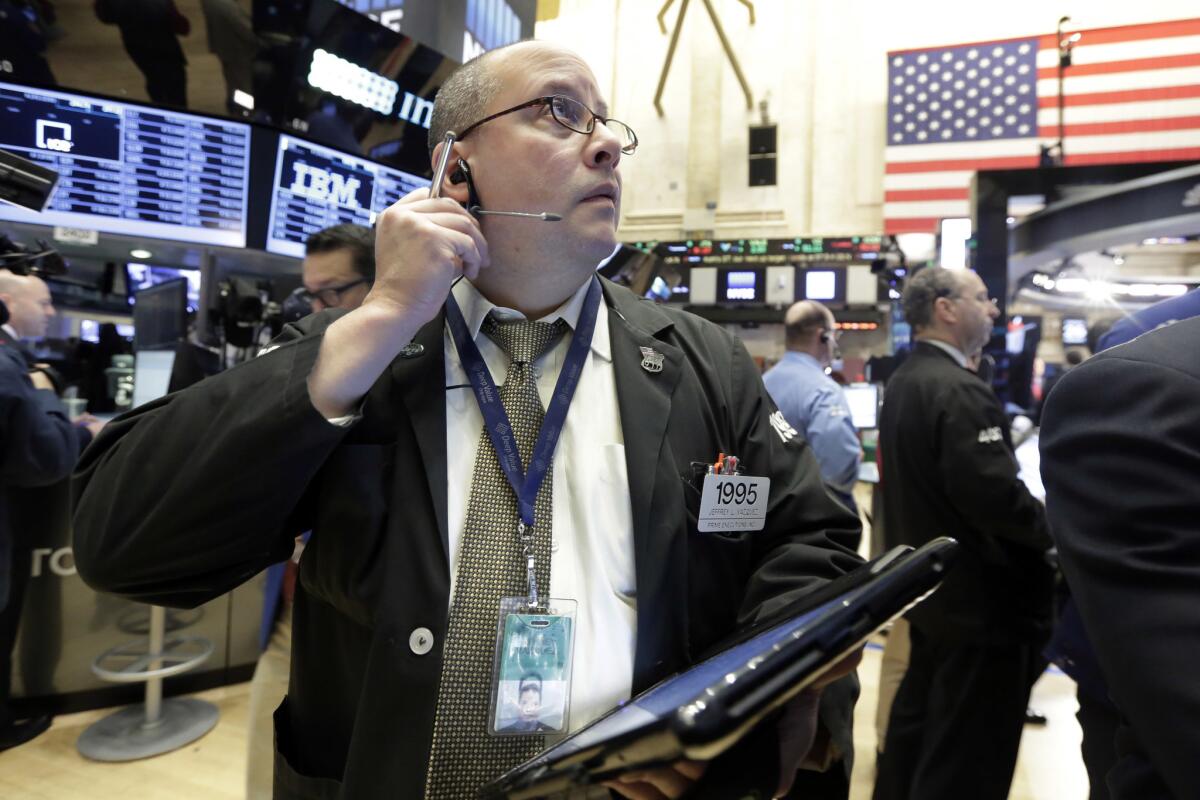 Trader Jeffrey Vazquez works on the floor of the New York Stock Exchange on Feb. 26.