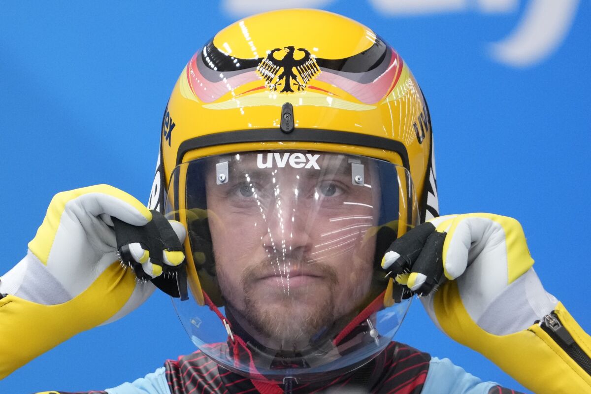 Johannes Ludwig, of Germany, prepares for the during the luge men's single round 3 at the 2022 Winter Olympics, Sunday, Feb. 6, 2022, in the Yanqing district of Beijing. (AP Photo/Pavel Golovkin)