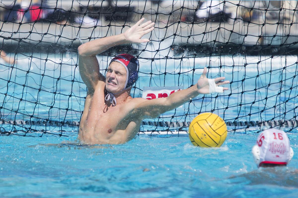 Blake Jackson of Newport Harbor blocks a shot by Mater Dei in the semifinals of the South Coast Tournament on Saturday.