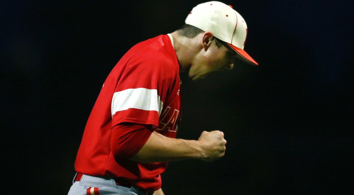 Orange Lutheran's Max Rajcic reacts after striking out a JSerra batter to end an inning during a game earlier this season.